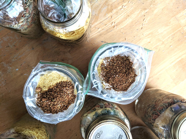 Mason jars with rice pilaf mix and seasonings inside