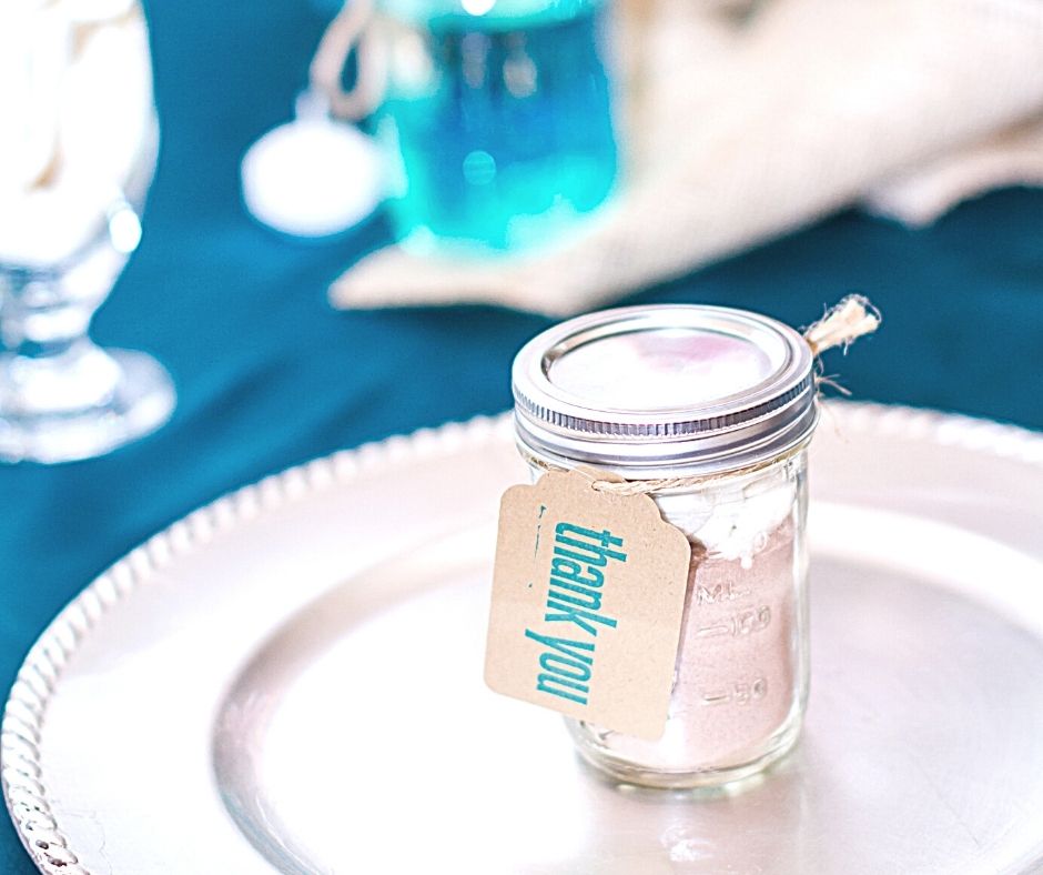Mason jar with thank you note on place setting