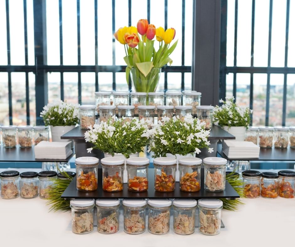 Stacks of mason jars with food on elegant display