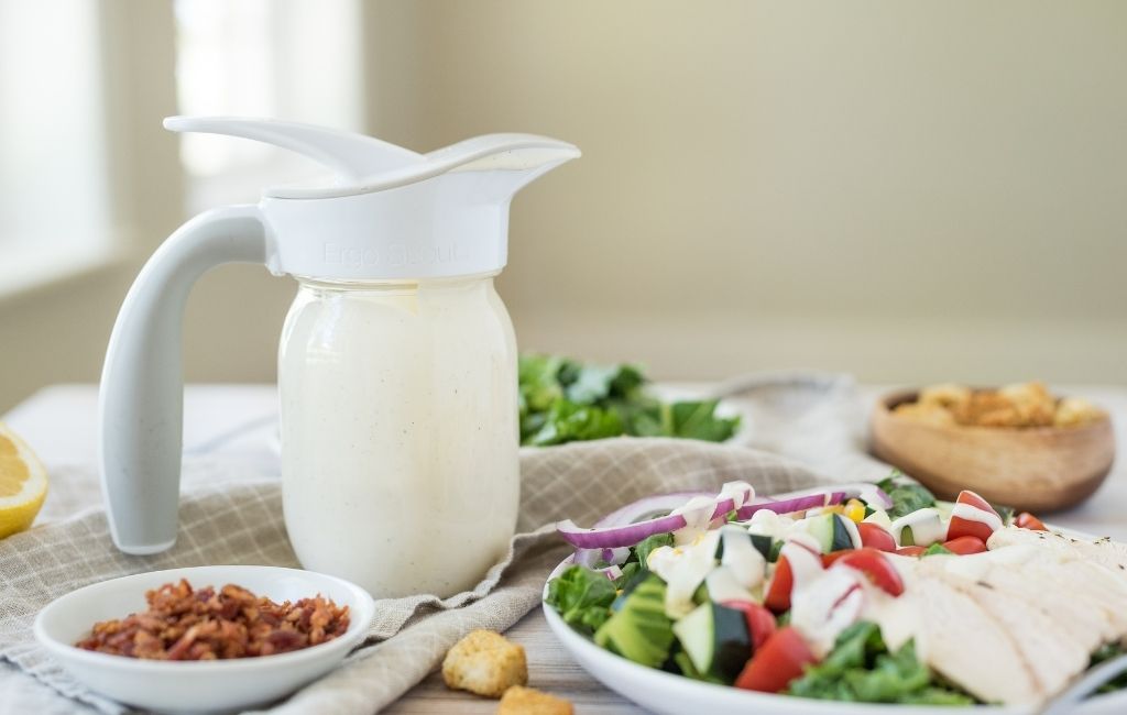Salad dressing in a mason jar with an Ergo Spout on top