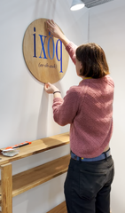 hanging logo on wall of tradeshow booth