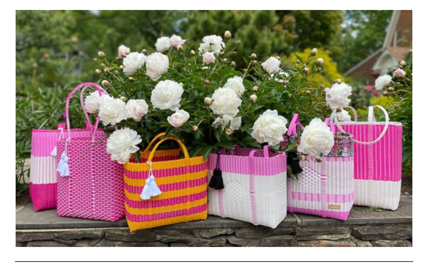 collection of cesta totes pinks set in a garden