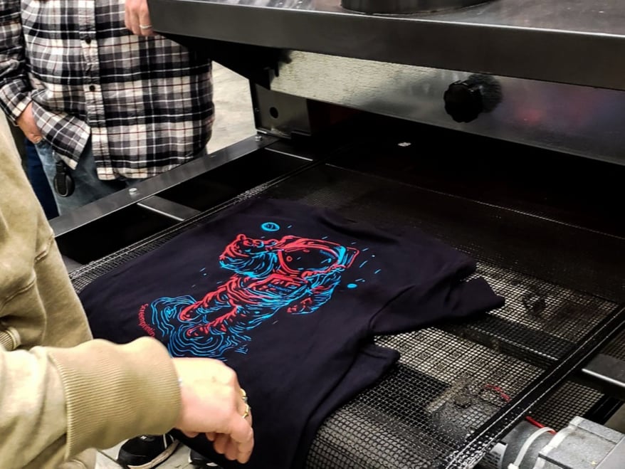 Shirts coming off the dryer at the Texsource Screen Printing 101 Class