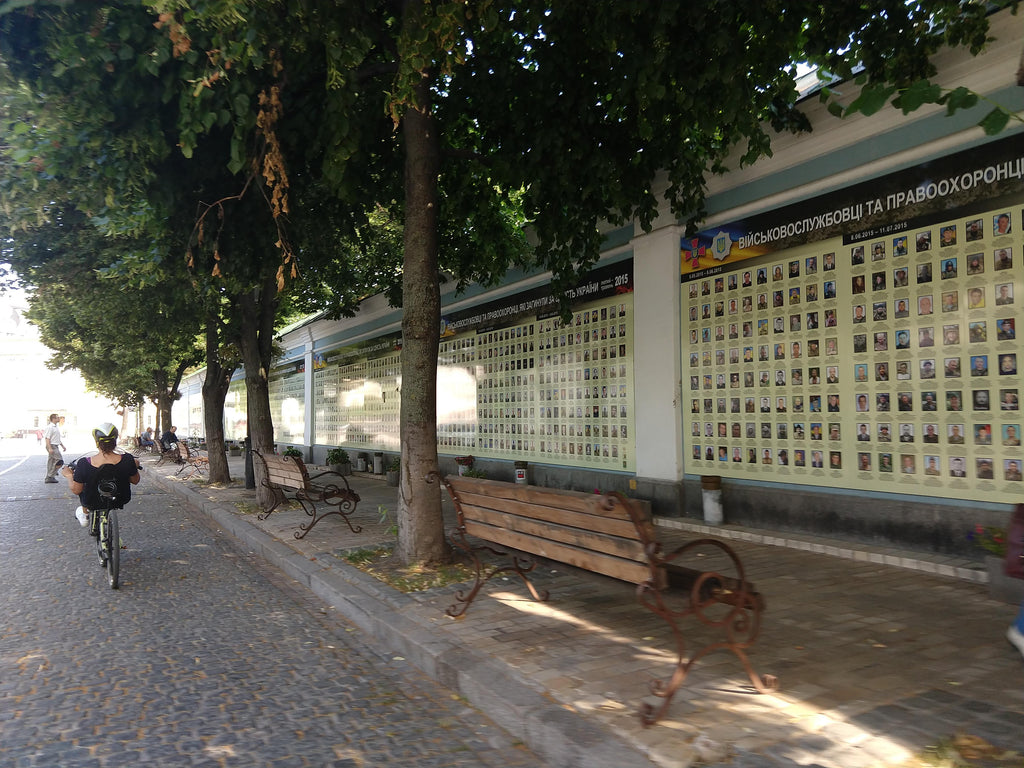 Cobblestone street next to a memorial to 12,000 dead in the ongoing war with Russian separatists.