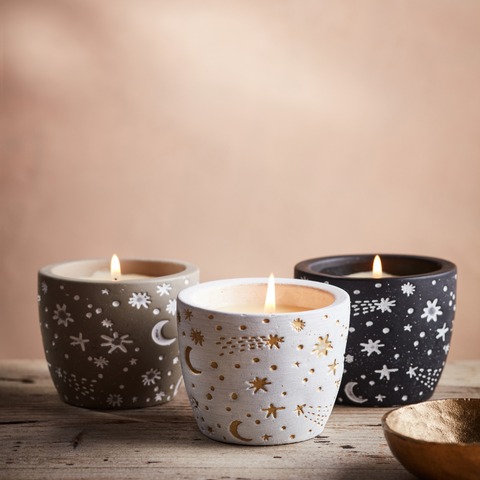 Celestial Collection with charming stars and moons scattered across white, black and grey pots