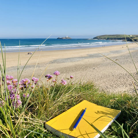 Emylia Hall's notebook nestled on the Cornish beach