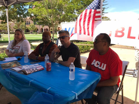 Matt Pizzolo, Indivisible's Kathy Stadler, ACLU Advocacy Director David Trujillo, and Council on American-Islamic Relations community liaison Yusef Miller for a panel on art and activism