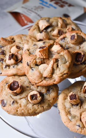 Chocolate chip cookies topped with Muddy Bites waffle cone snacks on a platter