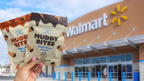 Milk chocolate and dark chocolate Muddy Bites waffle cone snacks held up in front of Walmart