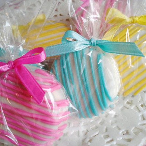 pink, blue, and yellow custom chocolate covered Oreos