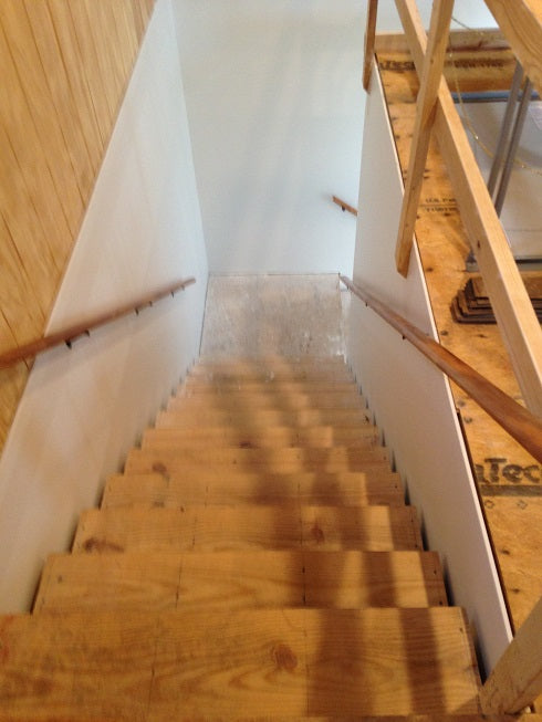 downstairs view of stairwell going to attic