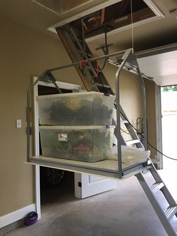 attic lift next to attic ladder