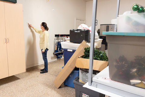 image of woman using attic lift