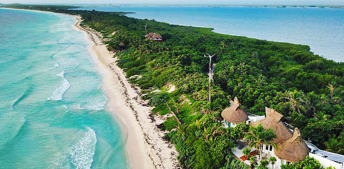 An aereal view of Casa Niños resort in Mexico photographed with Ultimadrone Love lift us up where we belong