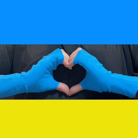 Hands together form a heart, on hands is pair of UPF50+ sun protective gloves in Bright Blue Mood color. All fabric is OEKO-TEX certified. A rectangle at top of square is blue, rectangle at bottom is yellow to symbolize the Ukrainian flag. 