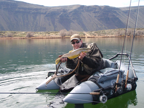 float tube fishing for brown trout in a lake