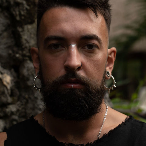 Alternative Male Model Wearing our Ceremony Spiked Earrings in Silver