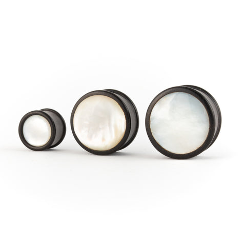 Dark wood and mother of pearl ear plugs