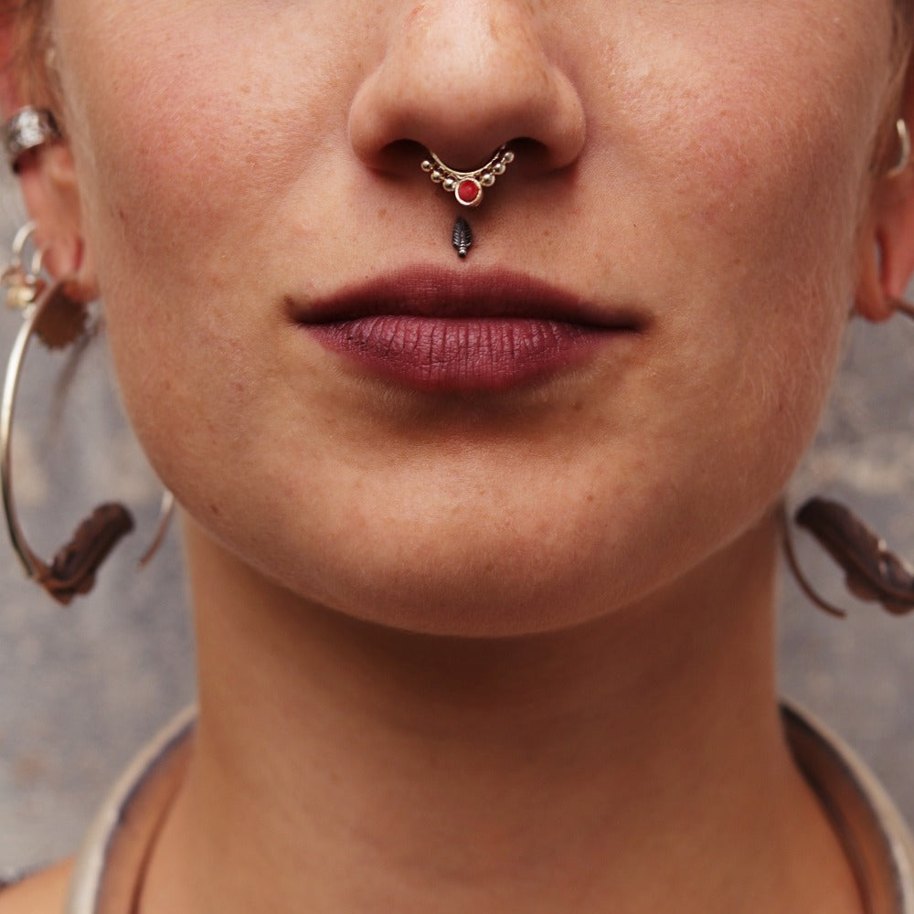 double nose and septum piercing