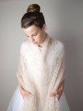 Wedding stole knitted of soft yarn for bridal gowns