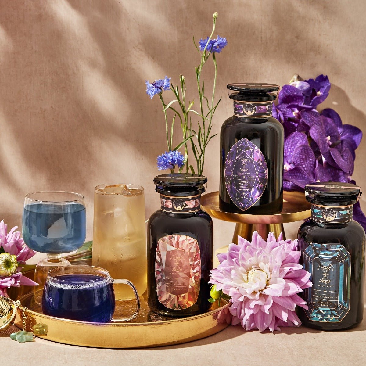 https://cdn.shopify.com/s/files/1/0022/4781/9364/products/12-month-gemstone-wellness-tea-subscription-monthly-tea-shipment-w-violet-glass-traveler-jar-10-15-cups-magic-hour-248524.jpg?v=1688752213