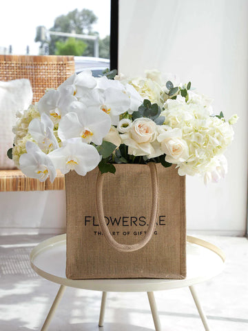 White flowers in a Jute Bag