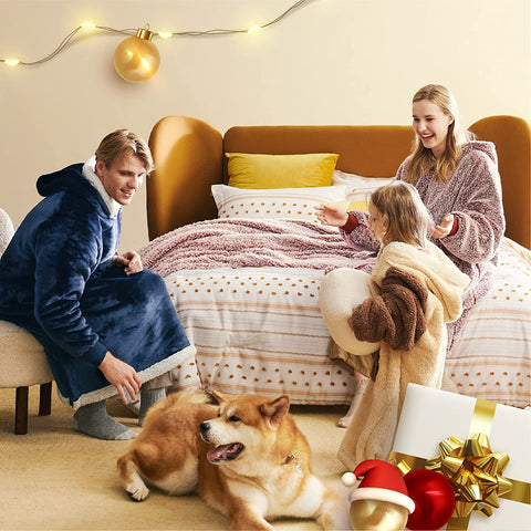 Family wearing Bedsure hoodie blankets & having fun in a living room