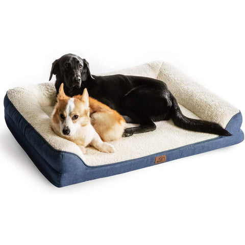 Medium-sized black dog and small white dog on Bedsure Memory Foam Dog Sofa