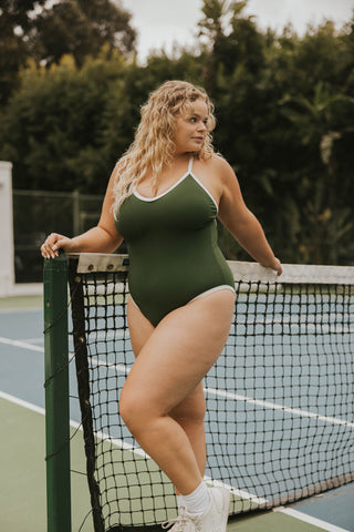 Forest green one-piece with white trim