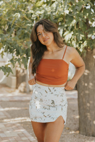 High-waisted swim skirt in a neutral color palette floral pattern