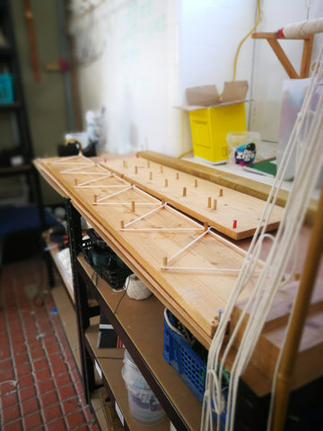 Interior of our workshop showing our wooden loom that we use to make our multi-ropes and garlands.  Our bubble toys are all as eco-friendly and plastic-free as we can possibly make them. 