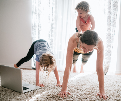 A family having fun and doing a home workout