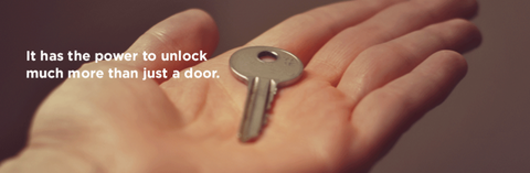 Photo of a key in a woman's hand with text "it has the power to unlock more than just a door."