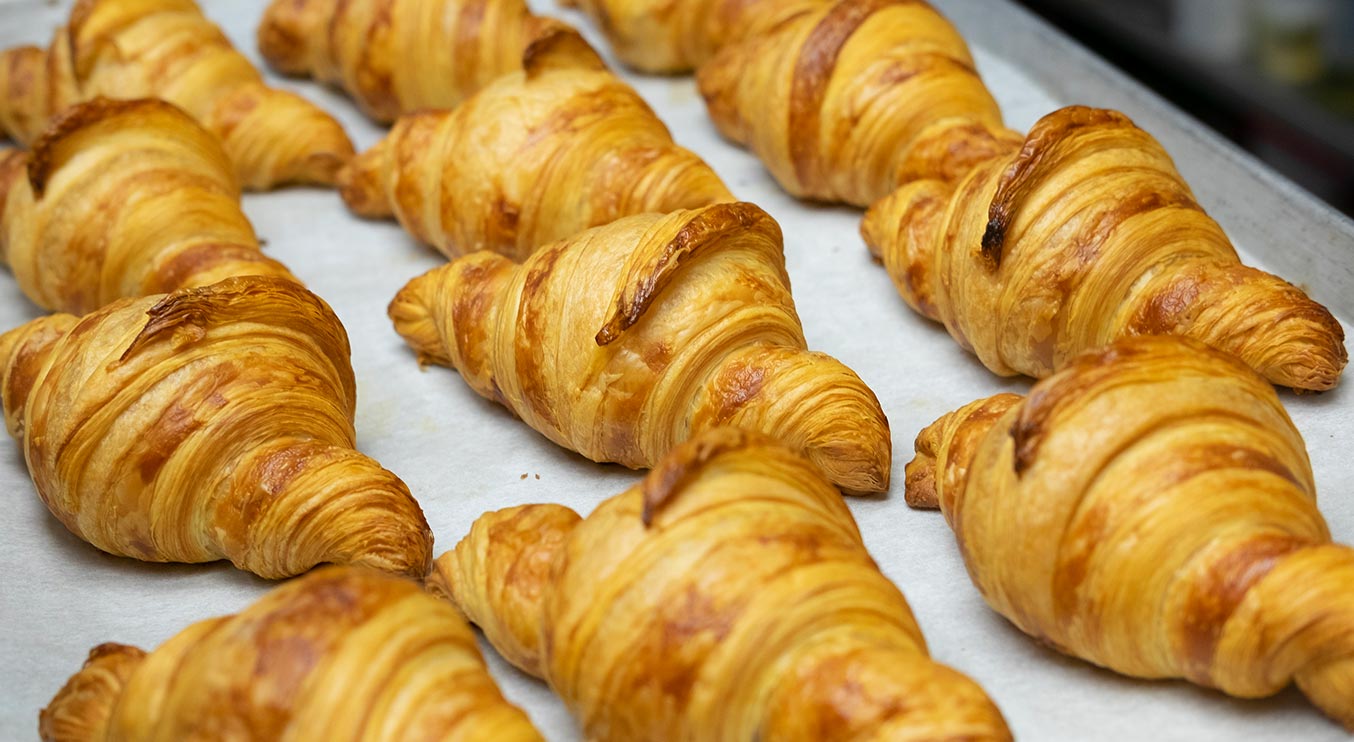 A tray of freshly baked croissants from Total Donut Solutions. Photo Credit: Christina Arsenault