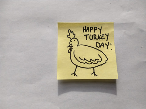 Post-it note with sharpie drawn illustration of turkey and the words "Happy Turkey Day".