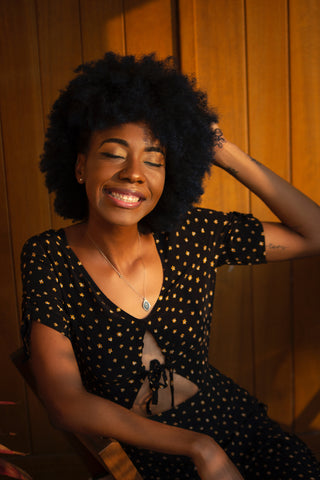 black girl massaging scalp for spring