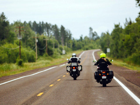 two motorcycle riders on the road