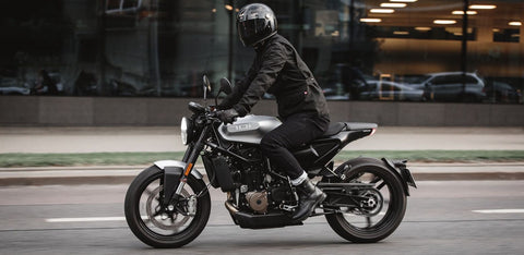 man riding a motorcycle solo