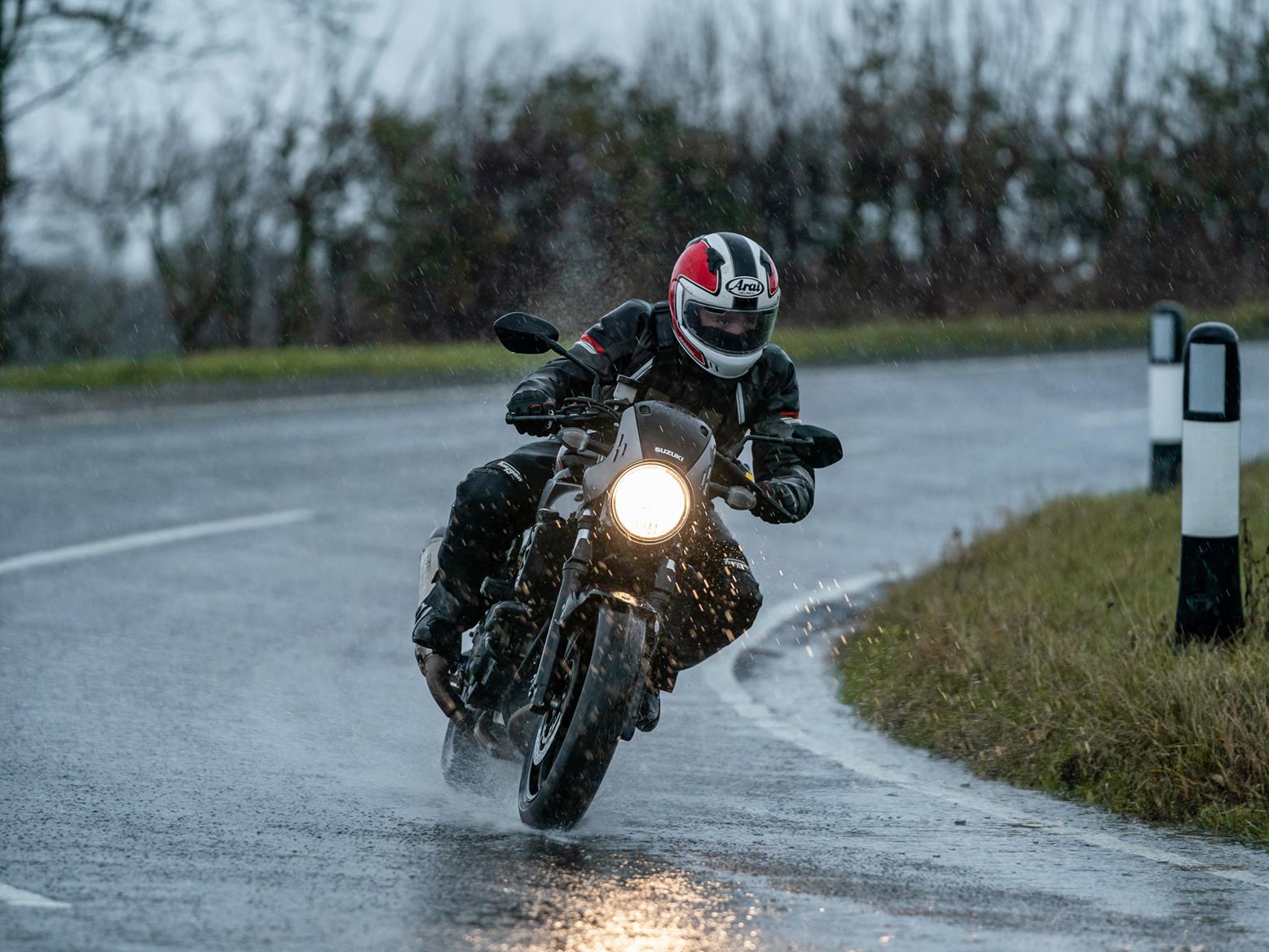 Man riding Motorcycle in Rain 