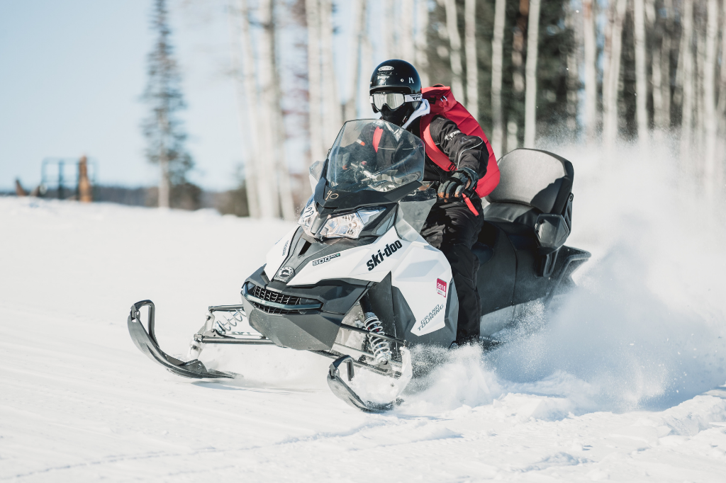 Heated clothing for snowmobiling
