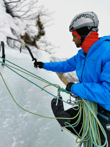 Chris Warner wearing the Guide Hoodie over Grid Pro Hoodie in the European Alps