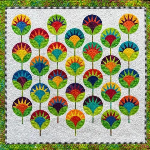 A green pieced batik quilt