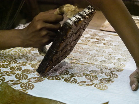 batik fabric being stamped prior to dyeing