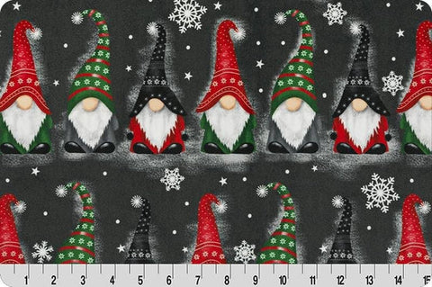 Soft dark fabric with rows of gnomes in colorful hats