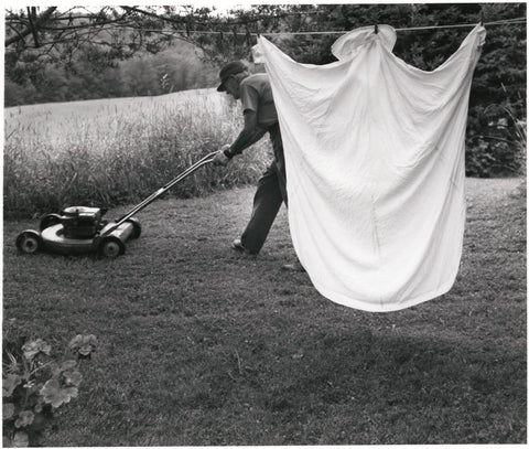 "Sheet on Line with Man Mowing Lawn", c. 1978, by Irene Fay
