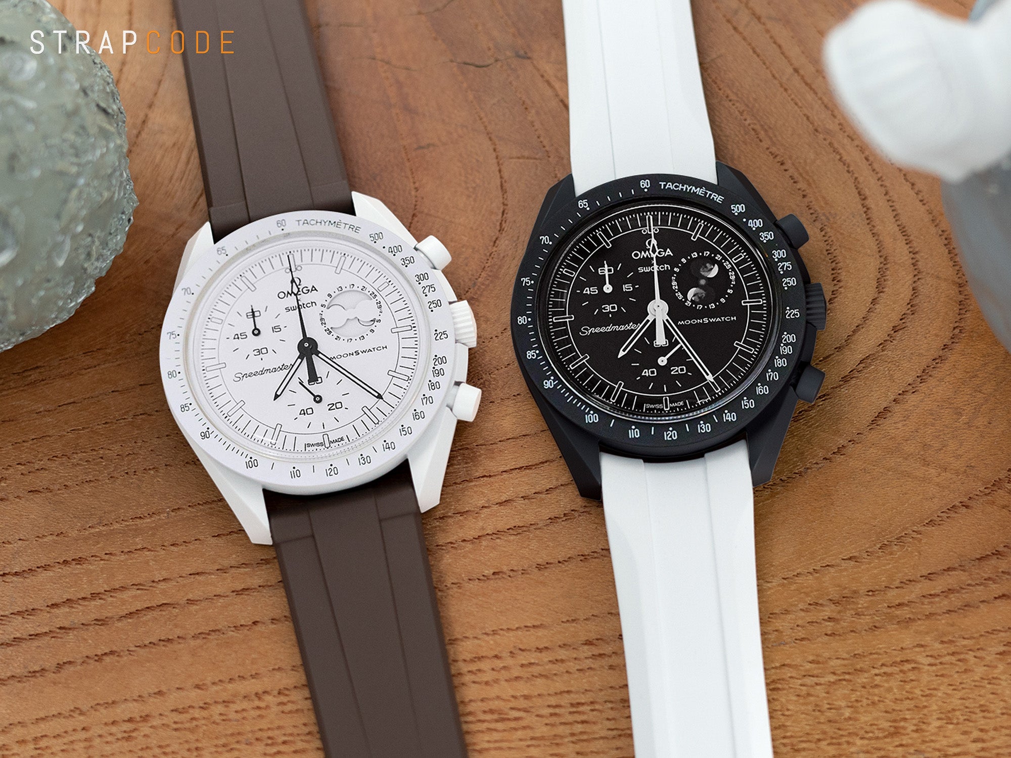 the Mission to Moonphase Snoopy MoonSwatch in both sleek black and classic white editions paired with FKM rubber watch bands from Strapcode