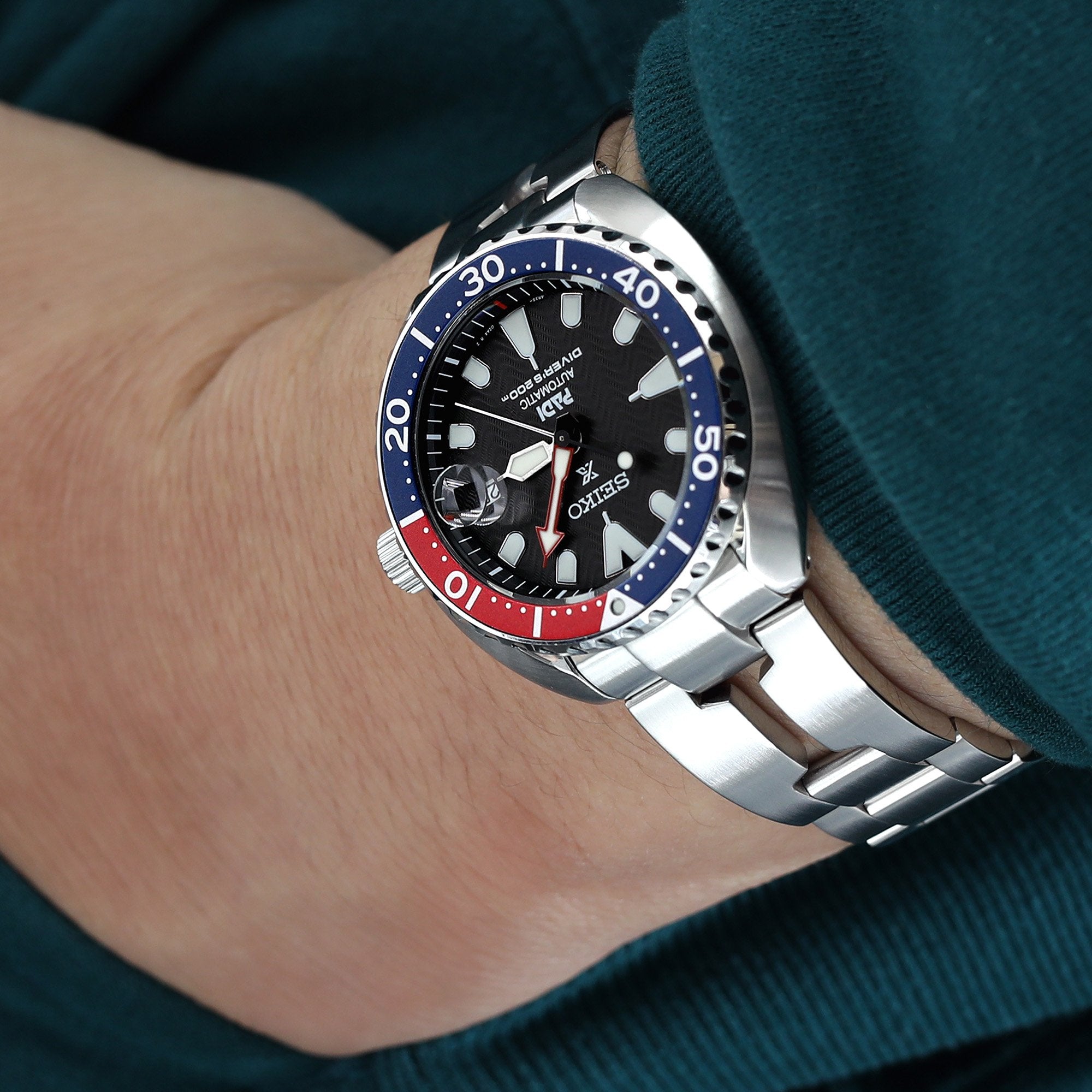 A Razor watch band by Strapcode  with a curved fit elevates the sporty look of the Seiko Mini Turtle watch by Strapcode 