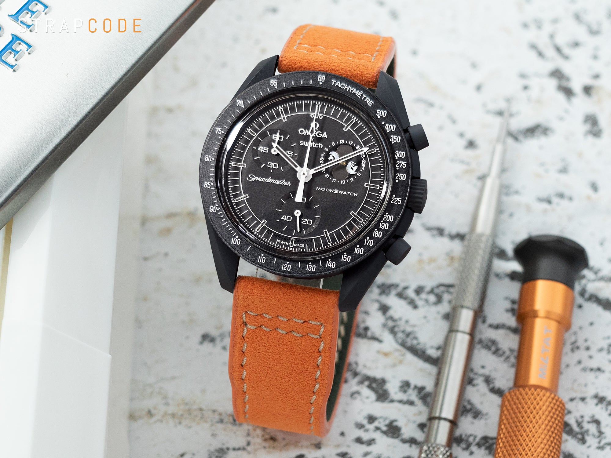 Mission to Moonphase Snoopy MoonSwatch pairs orange Alcantara fabric watch strap by Strapcode