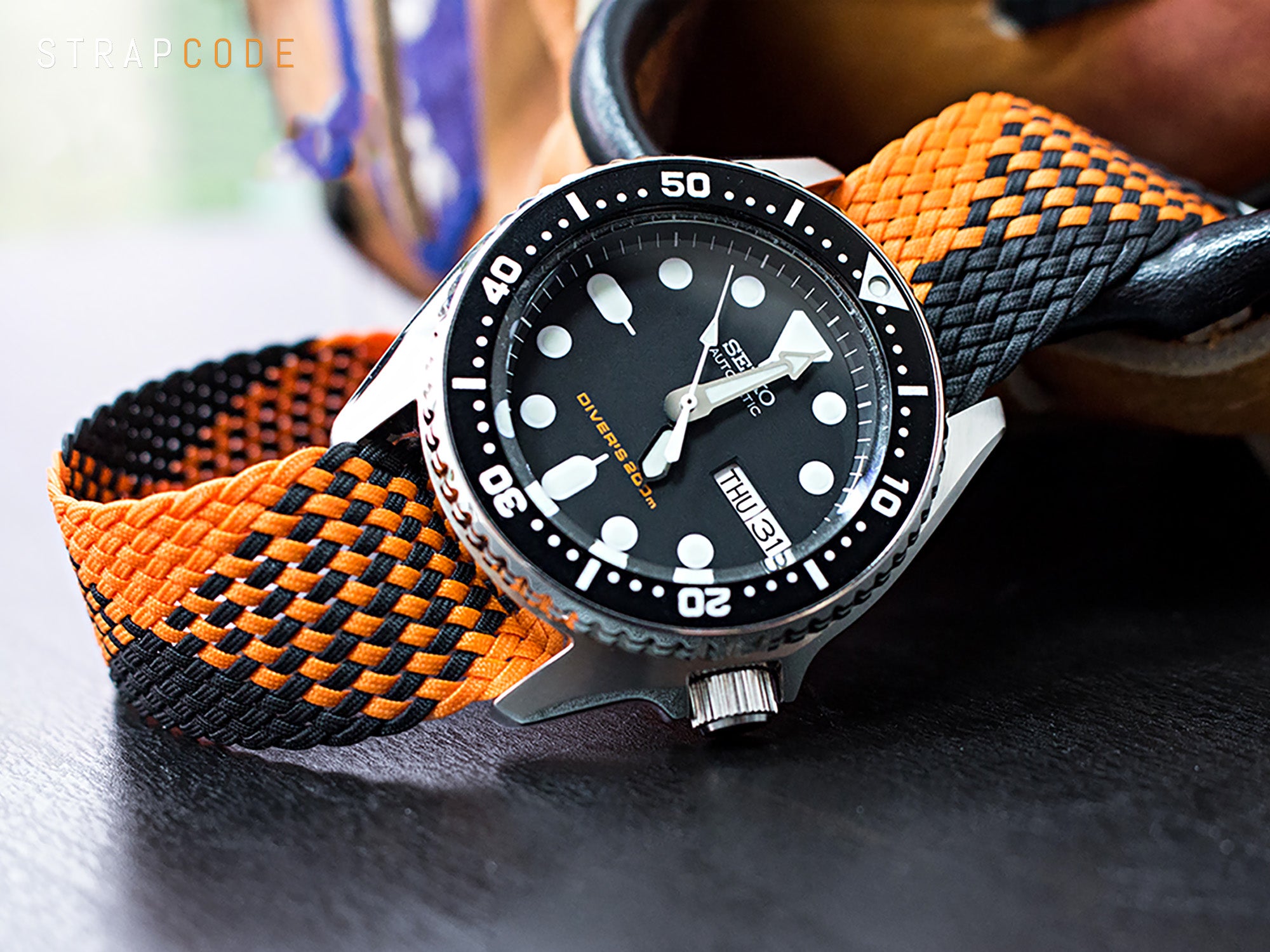 20mm MiLTAT Perlon Watch Strap in Black and Orange on Seiko Diver SKX013 by Strapcode watch bands