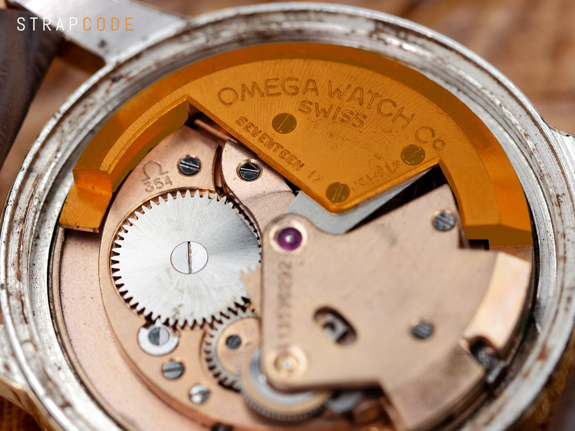 The image features the vintage Omega Seamaster with a bumper rotor on 354 caliber